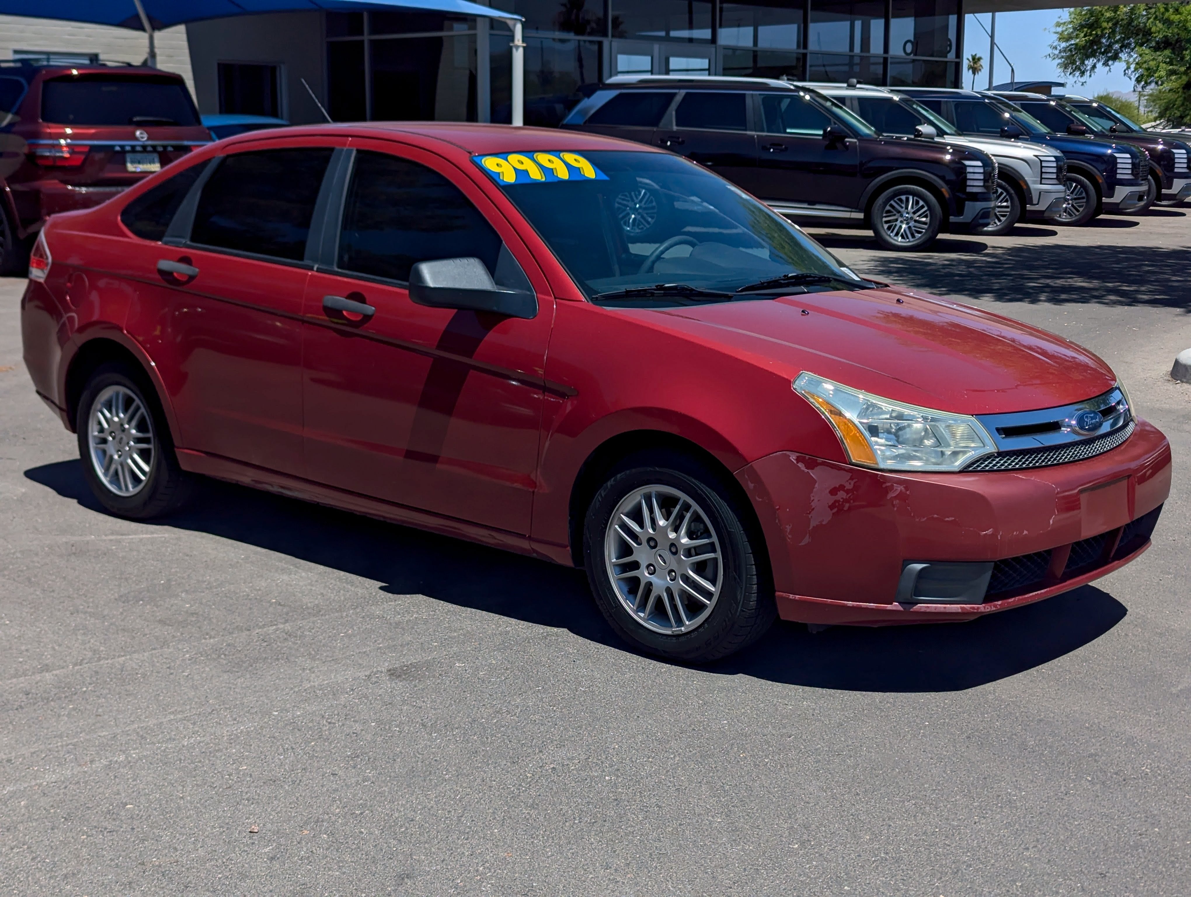 2010 Ford Focus SE in Red — front three-quarter view